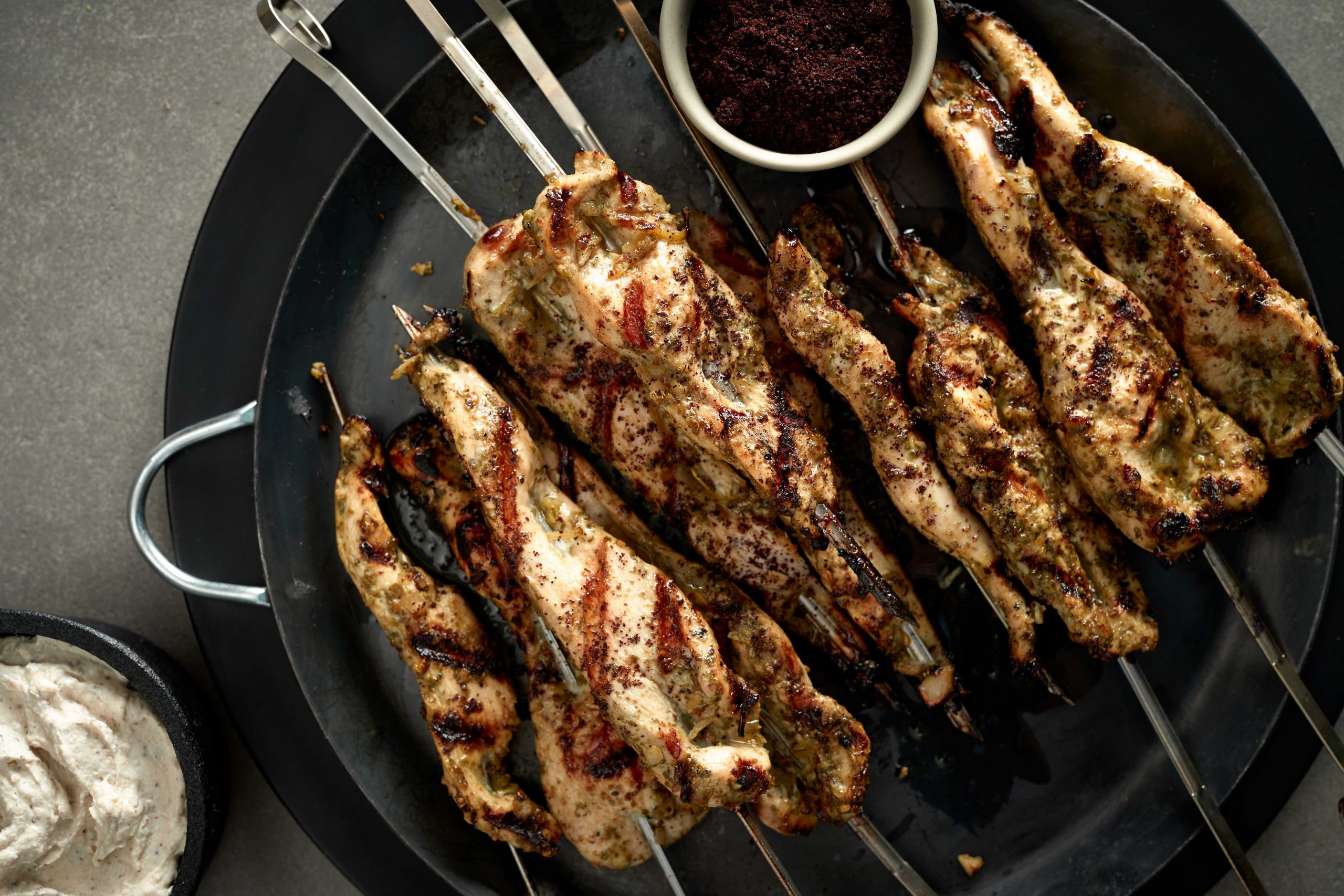 ZA’ATAR CHICKEN SKEWERS WITH TAHINI SUMAC DIPPING SAUCE
